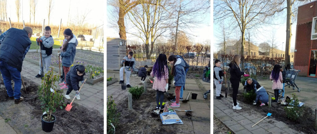 Kinderen maken de tuin van de Velserpoort in orde